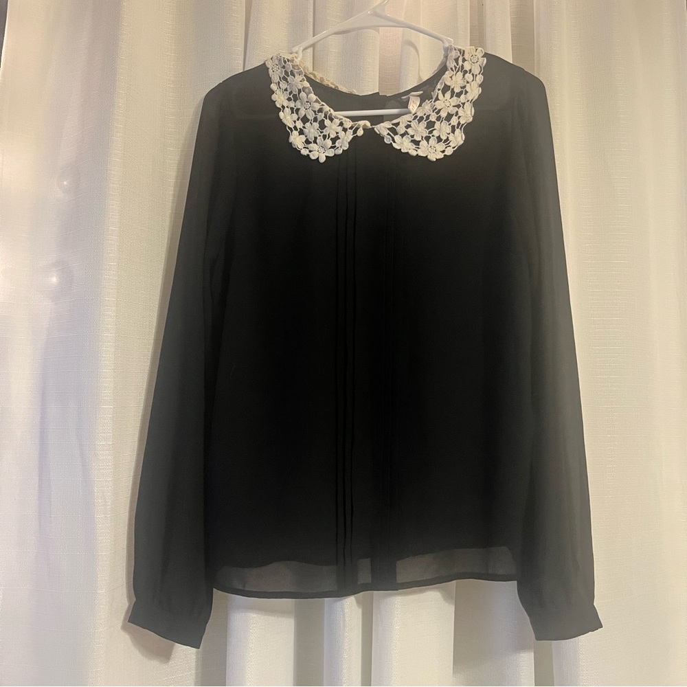 Black blouse with off white lace collar. Button up on the back.